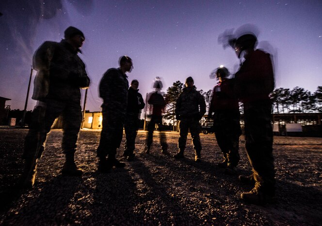 Members of the 628th Security Forces Squadron receive a safety brief before firing during a weapons familiarization and proficiency training course March 14, 2013, at Ft. Jackson, S.C. The 628th SFS performed the training for M240B proficiency for use on patrol boats on the Cooper River and surrounding area. (U.S. Air Force photo/ Senior Airman George Goslin)