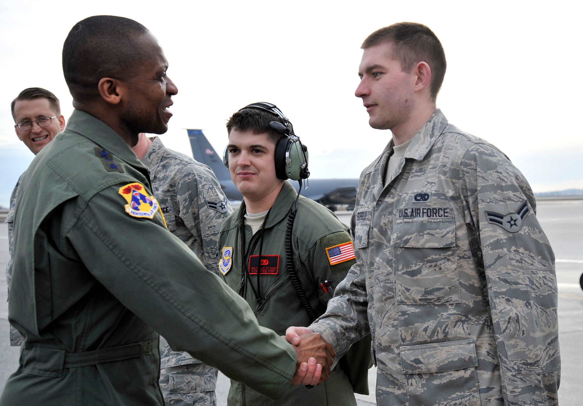 Lt. Gen. Darren McDew, 18th Air Force commander, shakes hands with an Airman on the flight line at Fairchild Air Force Base, Wash., March 14, 2013, before returning to Scott Air Force Base, Ill. McDew said one of the favorite parts of his visit was interacting with Airmen. (U.S. Air Force photo by Airman 1st Class Janelle Patiño)