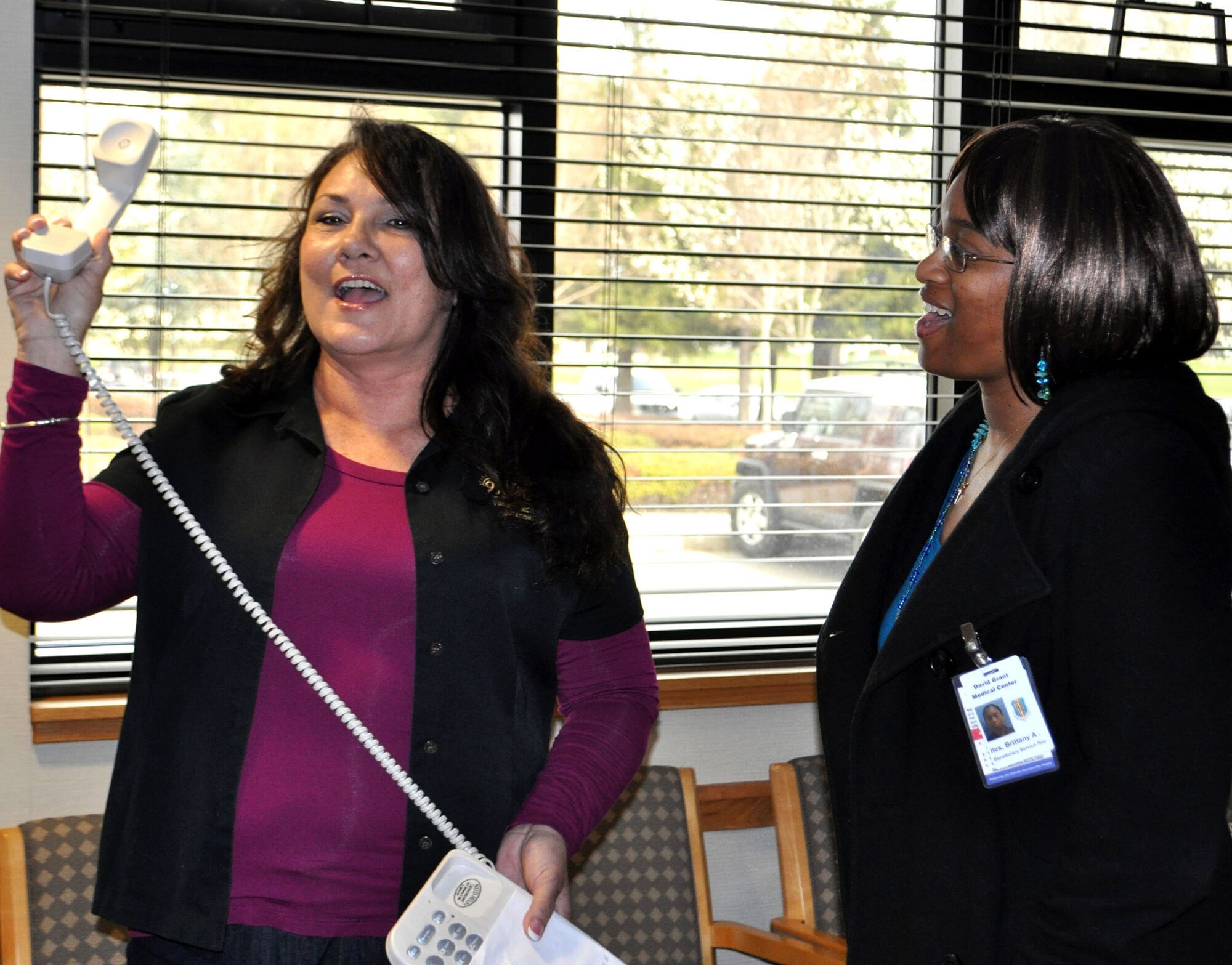 TRAVIS AIR FORCE BASE, Calif. -- Coffee Break Coordinator Barbara Hoover, with KUIC 95.3 radio, and Staff Sgt. Brittany Iles give the camera a big thumbs up for another successful Coffee Break. A regular listener, Iles called the station to request the break for her unit, the 349th AMDS, at Travis AFB. Hoover said she does quite a few Coffee Breaks at Travis, and has three more coming up soon. "We love the folks out here at Travis, they're loyal listeners," she said. When not serving in the Reserve with the 349th AMDS, Iles works full-time at David Grant U.S. Air Force Medical Center. (U.S. Air Force photo/Senior Master Sgt. Ellen Hatfield)