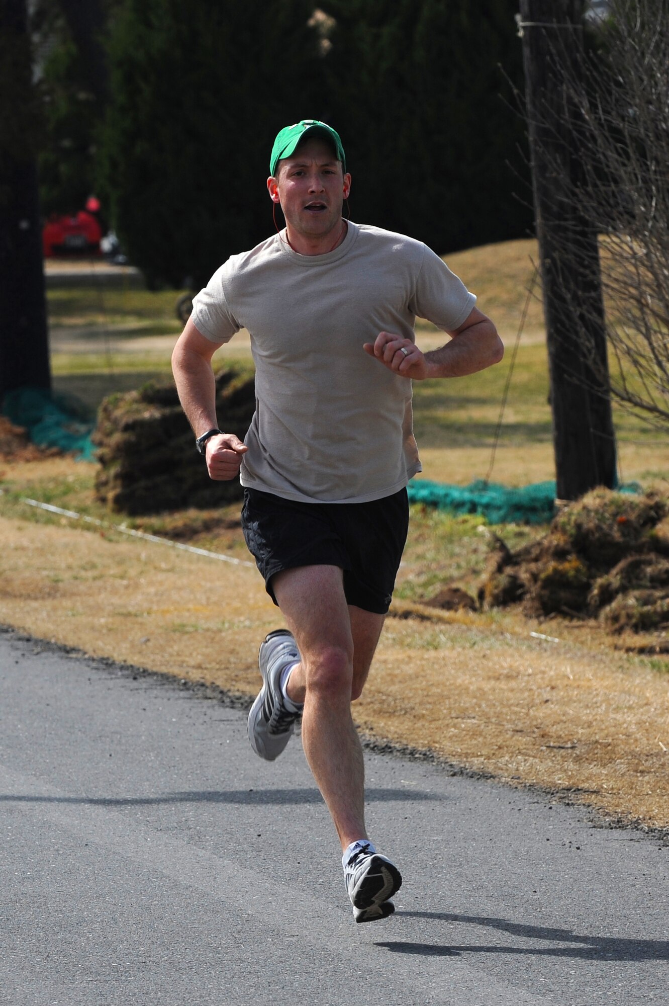 Justin Delorit, 8th Civil Engineer Squadron, sprints to the finish for the 2013 St. Patrick’s Day Fun Run at Kunsan Air Base, Republic of Korea, Mar. 16, 2013. Delorit was the first person to complete the ten-kilometer run, with a time of 38:56. (U.S. Air Force photo by Staff Sgt. Jonathan Fowler/Released)