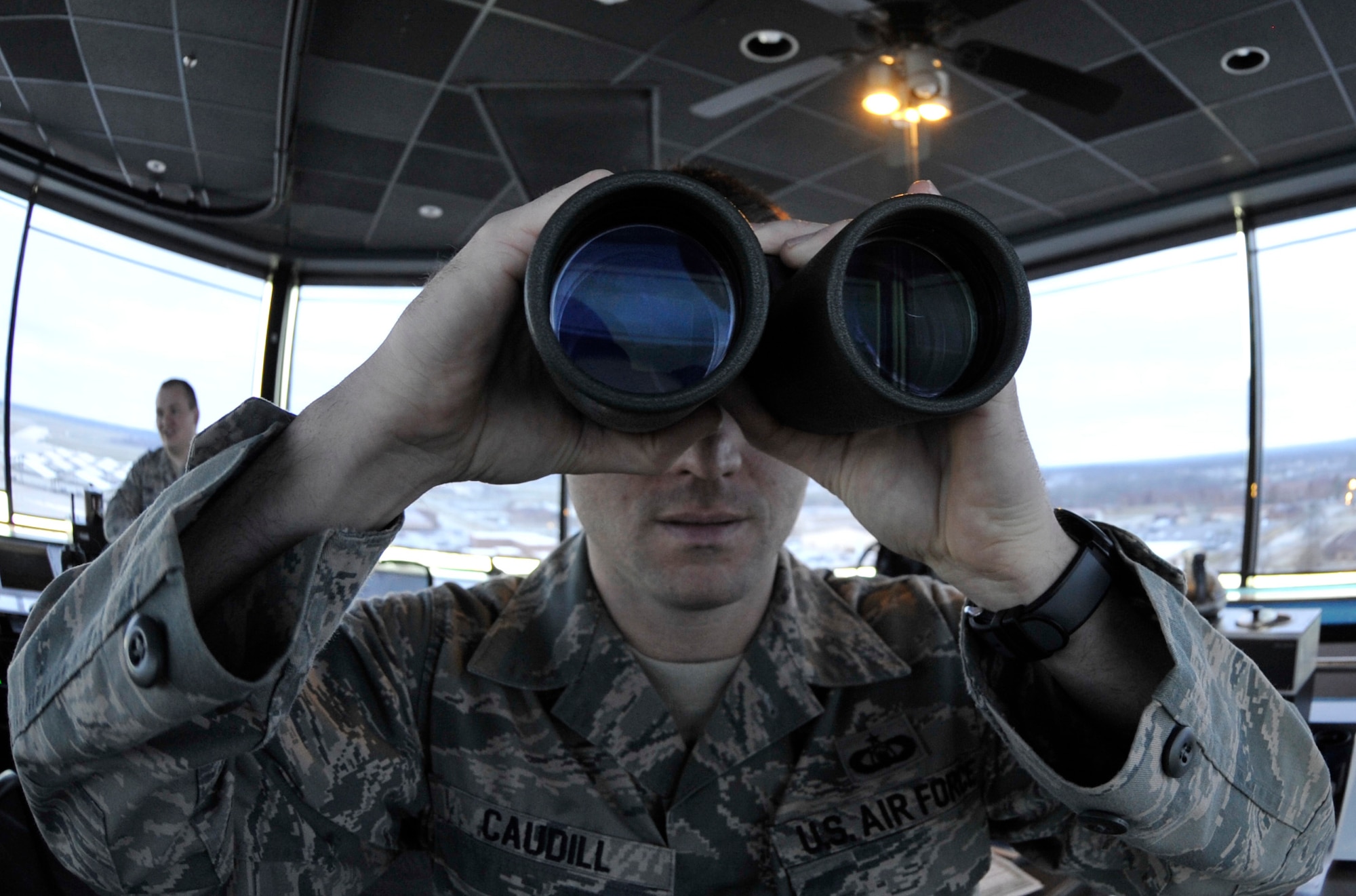 Staff Sgt. Blaine Caudill, 509th Operations Support Squadron air traffic control watch supervisor, scans the skies around Whiteman Air Force Base for birds, March 11, 2013. Scanning for birds is an important procedure that helps prevent accidental strikes by aircraft. (U.S. Air Force photo by Airman 1st Class Keenan Berry/Released)