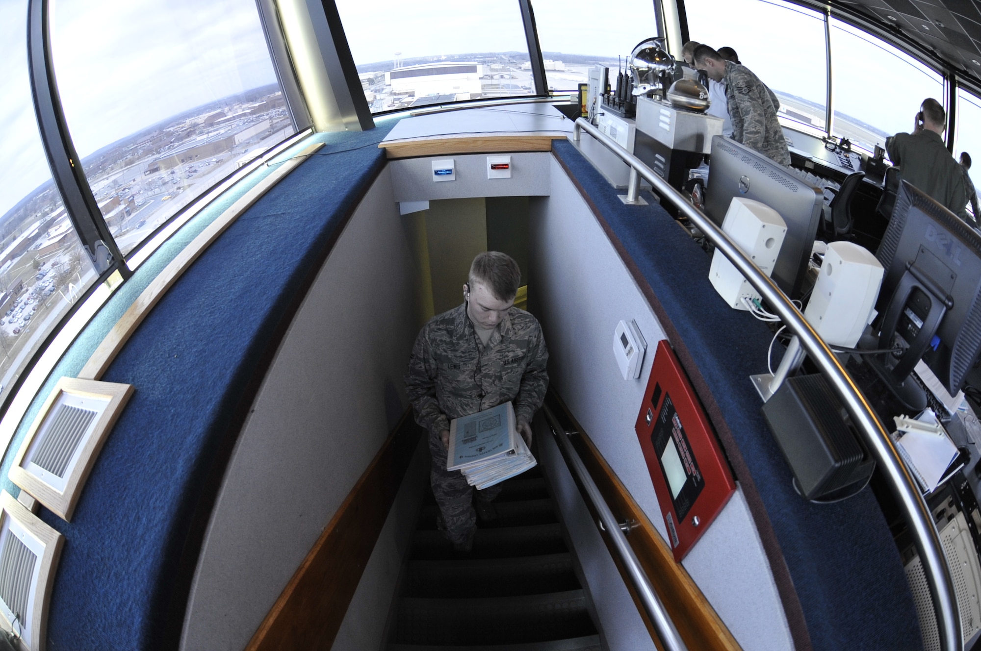 Airman 1st Class Seth Lewis, 509th Operations Support Squadron air traffic control apprentice, brings controller records to the tower, Whiteman Air Force Base, Mo., March 11, 2013. Air traffic controllers have to study daily to stay sharp and be prepared for any circumstances. (U.S. Air Force photo by Airman 1st Class Keenan Berry/Released)