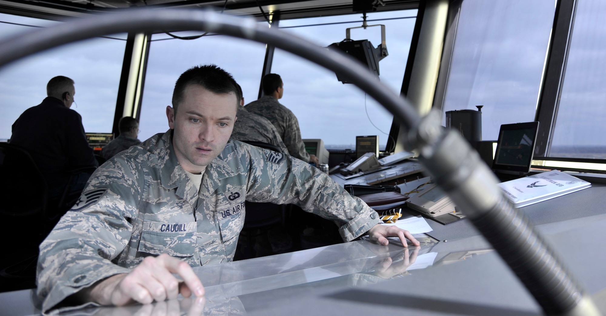 Staff Sgt. Blaine Caudill, 509th Operations Support Squadron air traffic control watch supervisor, reviews a crash grid map at Whiteman Air Force Base, Mo., March 11, 2013. In the event of an aircraft crash, the map is used to provide a detailed location of the crash site. (U.S. Air Force photo by Airman 1st Class Keenan Berry/Released)