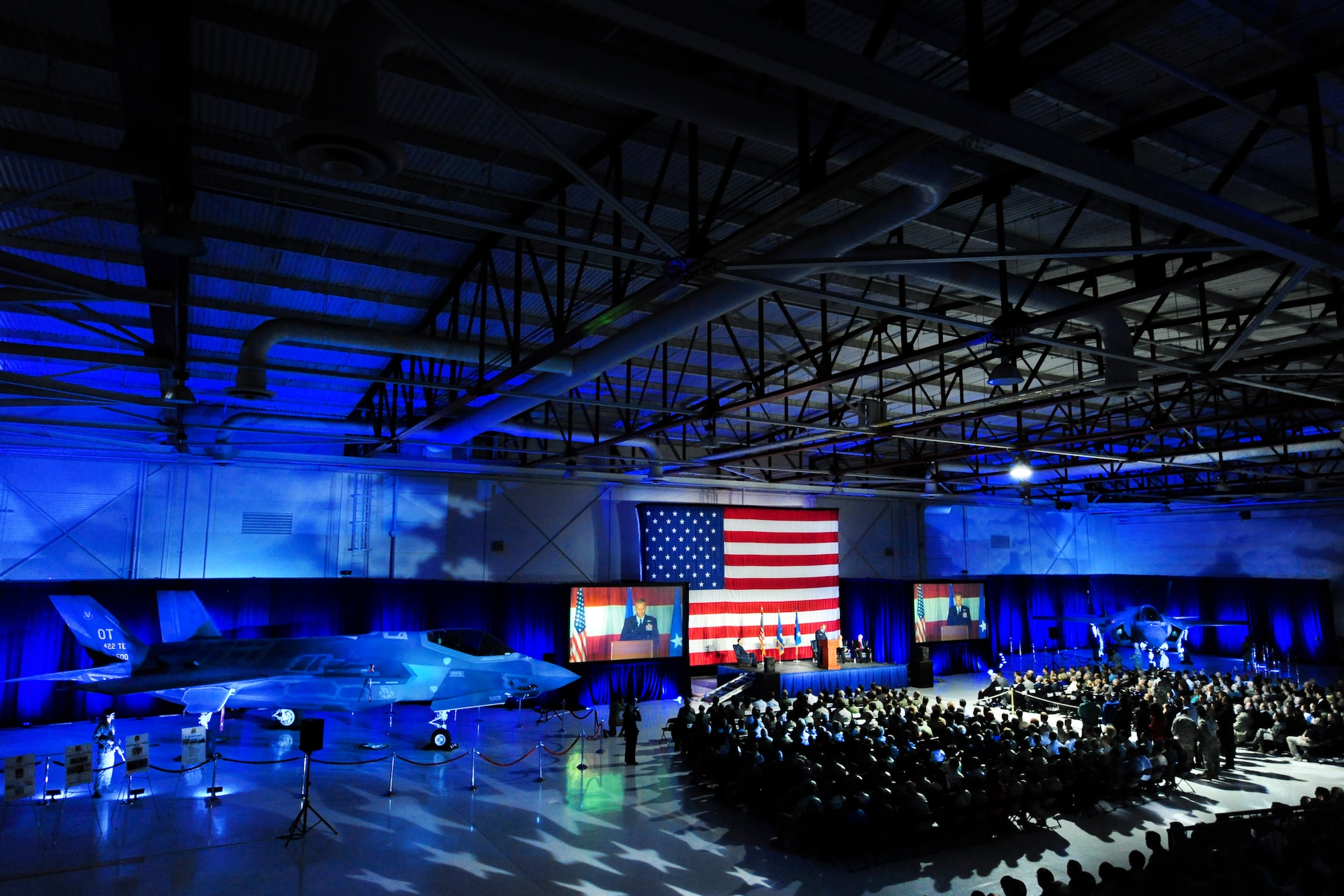 Maj. Gen. Jeffery Lofgren, U.S. Air Force Warfare Center commander, provides remarks during the F-35A Lightning II arrival ceremony March 19, 2013, in the Thunderbird Hangar on Nellis Air Force Base, Nev.  The 422nd Test and Evaluation Squadron will design the tactics for the F-35A. The squadron will also determine how to integrate the F-35A with other aircraft in the Air Force inventory. (U.S. Air Force photo by Lawrence Crespo)