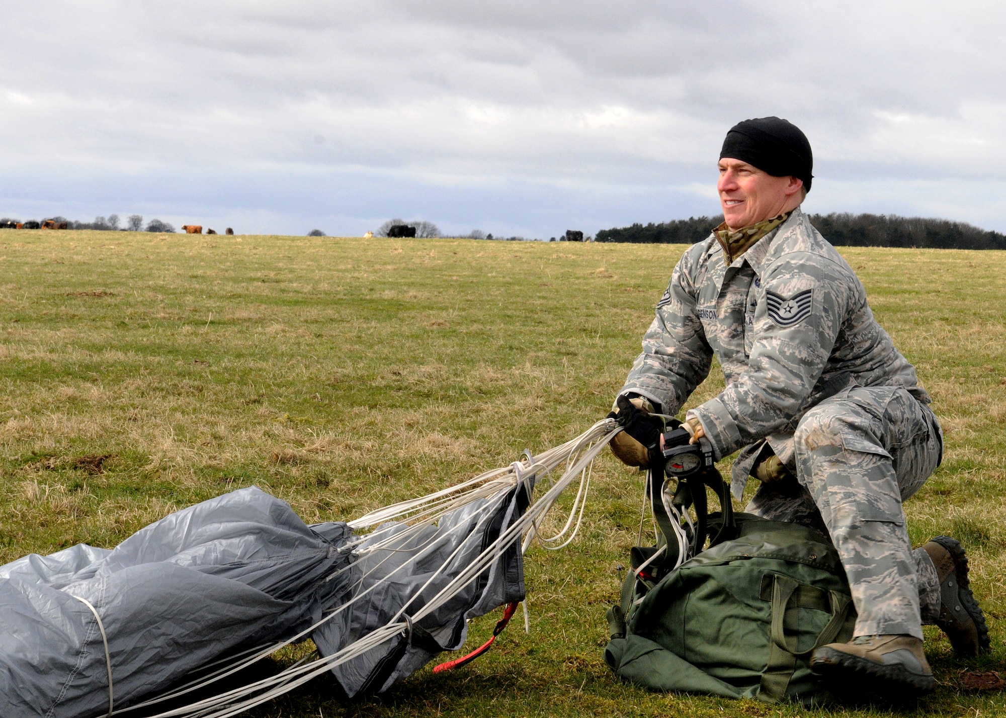 Tech. Sgt. Stefan Jorgenson, 321st Special Tactics Squadron combat controller, packs his parachute after making a free-fall jump March 12, 2013, over Sculthorpe, England. Jorgenson and other 321st STS members took part in the week long jump exercise geared toward keeping the special operations Airmen proficient in their ability to tactically insert themselves into potentially austere locations. (U.S. Air Force photo by 1st Lt. Christopher Mesnard/Released)