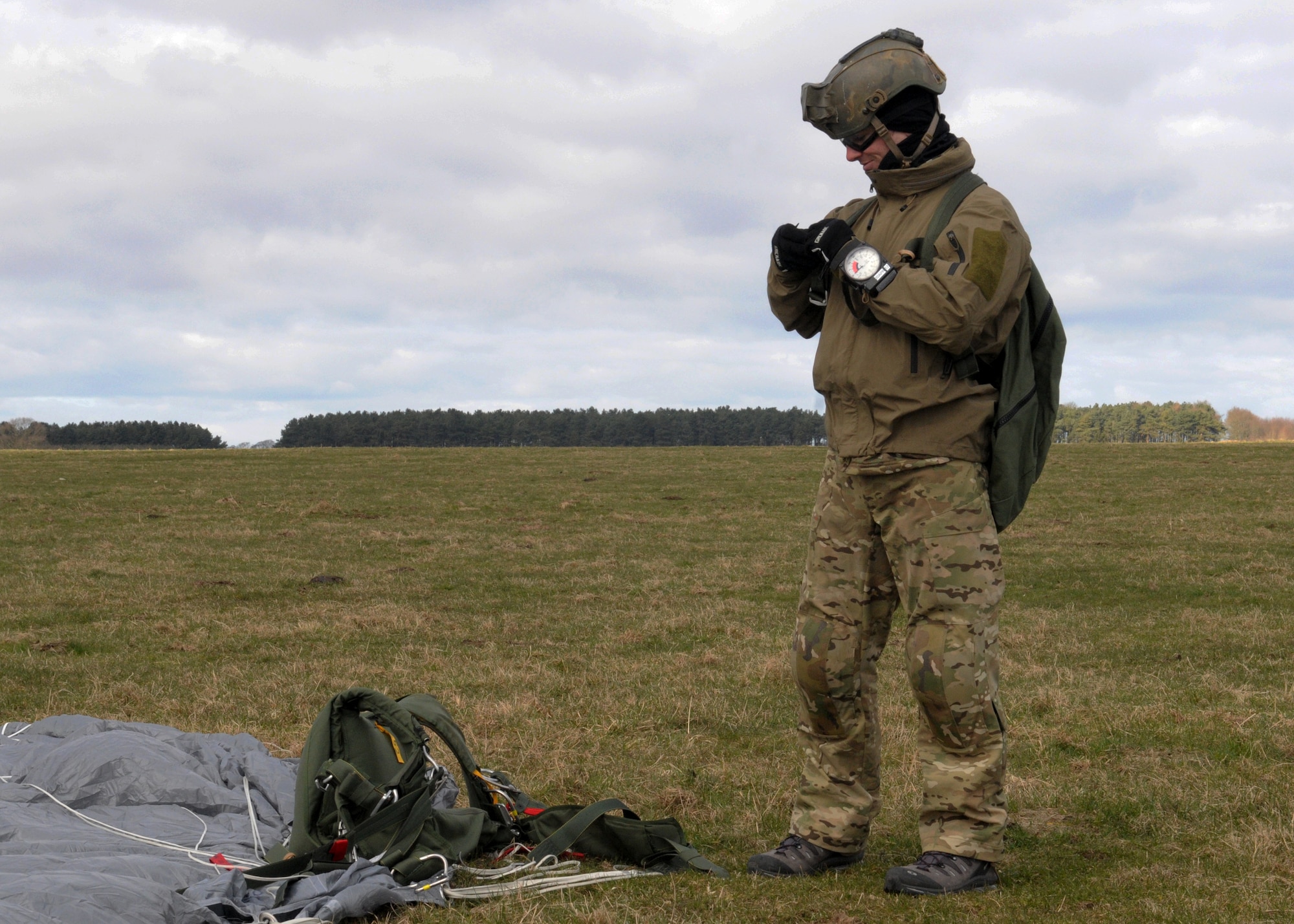 Staff Sgt. Nicholas Fabozzi 321st Special Tactics Squadron pararescueman, collects his gear after successfully landing March 12, 2013, in a field near Sculthorpe, England. Fabozzi and other 321st STS members took part in the unit’s Jump Week to maintain their ability to tactically infiltrate austere locations. U.S. Air Force pararescuemen, are trained to recover people who are injured in spite of potential enemy combatants or austere locations. (U.S. Air Force photo by 1st Lt. Christopher Mesnard/Released)   