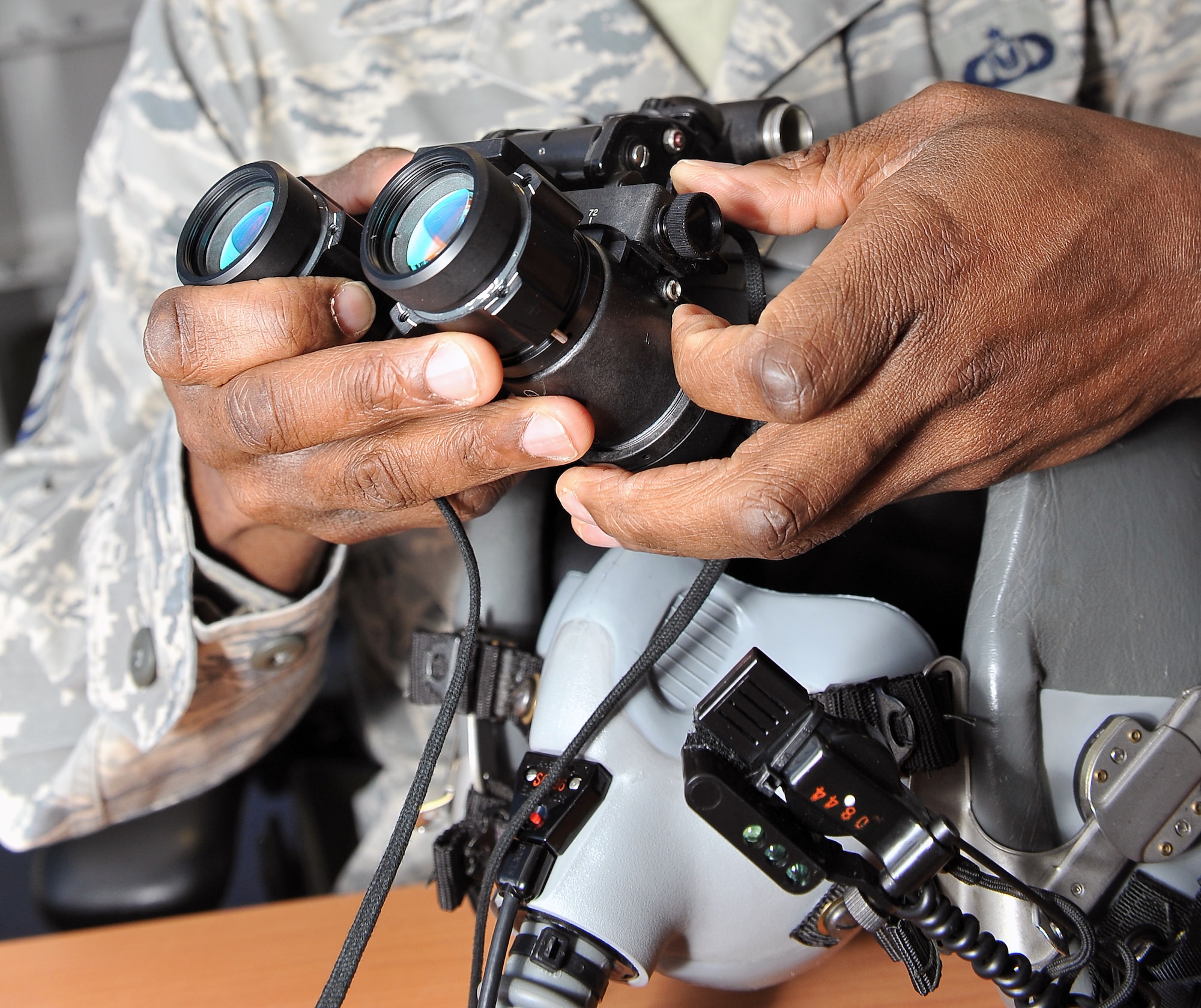 Tech. Sgt. Timothy Ledford, 86th Operations Support Squadron aircrew flight equipment craftsman, attaches night-vision goggles to a helmet, March 20, 2013, Ramstein Air Base, Germany. Ledford was honored with the aircrew flight equipment NCO of the year award for his outstanding accomplishments. (U.S. Air Force photo/Airman 1st Class Dymekre Allen)