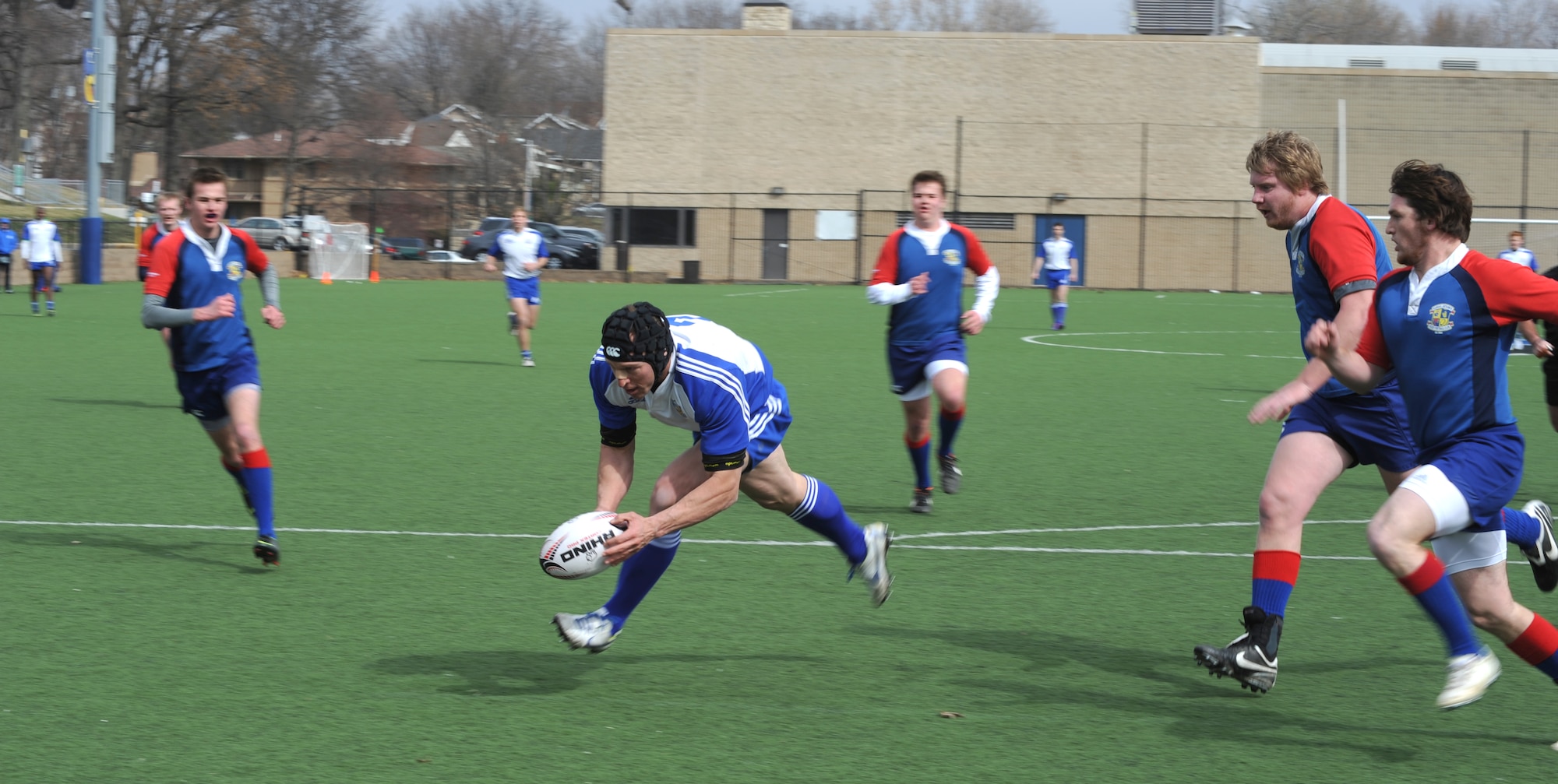 Nate Conkey, Kansas City Blues Rugby Club, successfully grabs the ball during practice in Kansas City, Mo., March 16, 2013. A U.S. Army major, Conkey is one of a handful of Service members who makes the trip to Kansas City three times a week to practice and play with the Blues. (U.S. Air Force photo by Senior Airman Brigitte N. Brantley/Released)