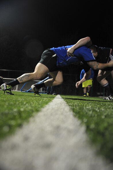 Zachary Hildebrand, Kansas City Blues Rugby Club player, performs “up-down” scrum drills during practice in Kansas City, Mo., March 14, 2013. Hildebrand, a U.S. Air Force staff sergeant, makes the two-hour round-trip three times a week from Whiteman Air Force Base, Mo., to practice and play with the team. (U.S. Air Force photo by Senior Airman Brigitte N. Brantley/Released)