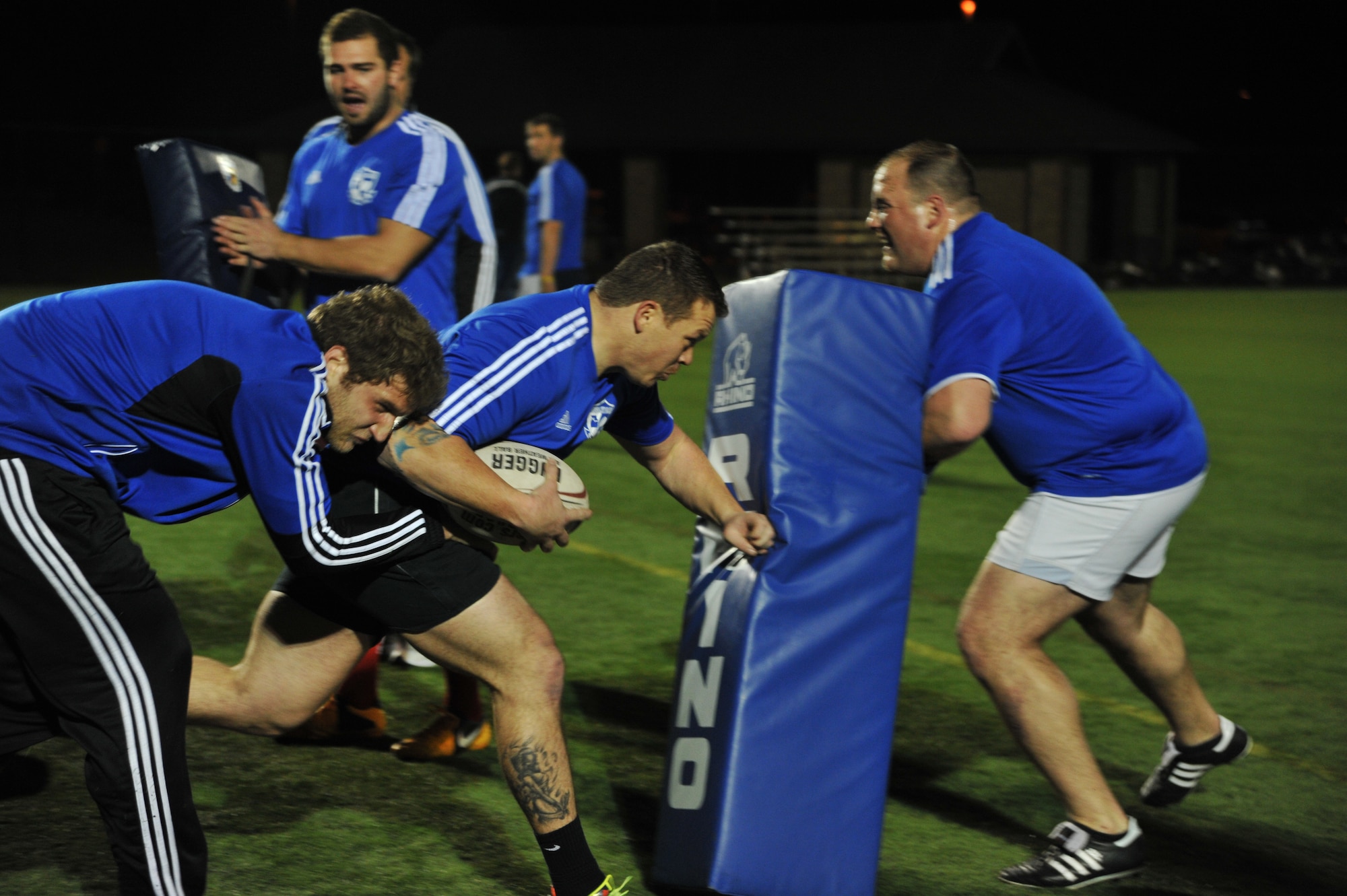 Zachary Hildebrand, Kansas City Blues Rugby Club player, tries to evade a tackle during practice in Kansas City, Mo., March 14, 2013. A U.S. Air Force staff sergeant stationed at Whiteman Air Force Base, Mo., Hildebrand plays rugby for its physicality, brotherhood and chaotic, yet organized, nature. (U.S. Air Force photo by Senior Airman Brigitte N. Brantley/Released) 