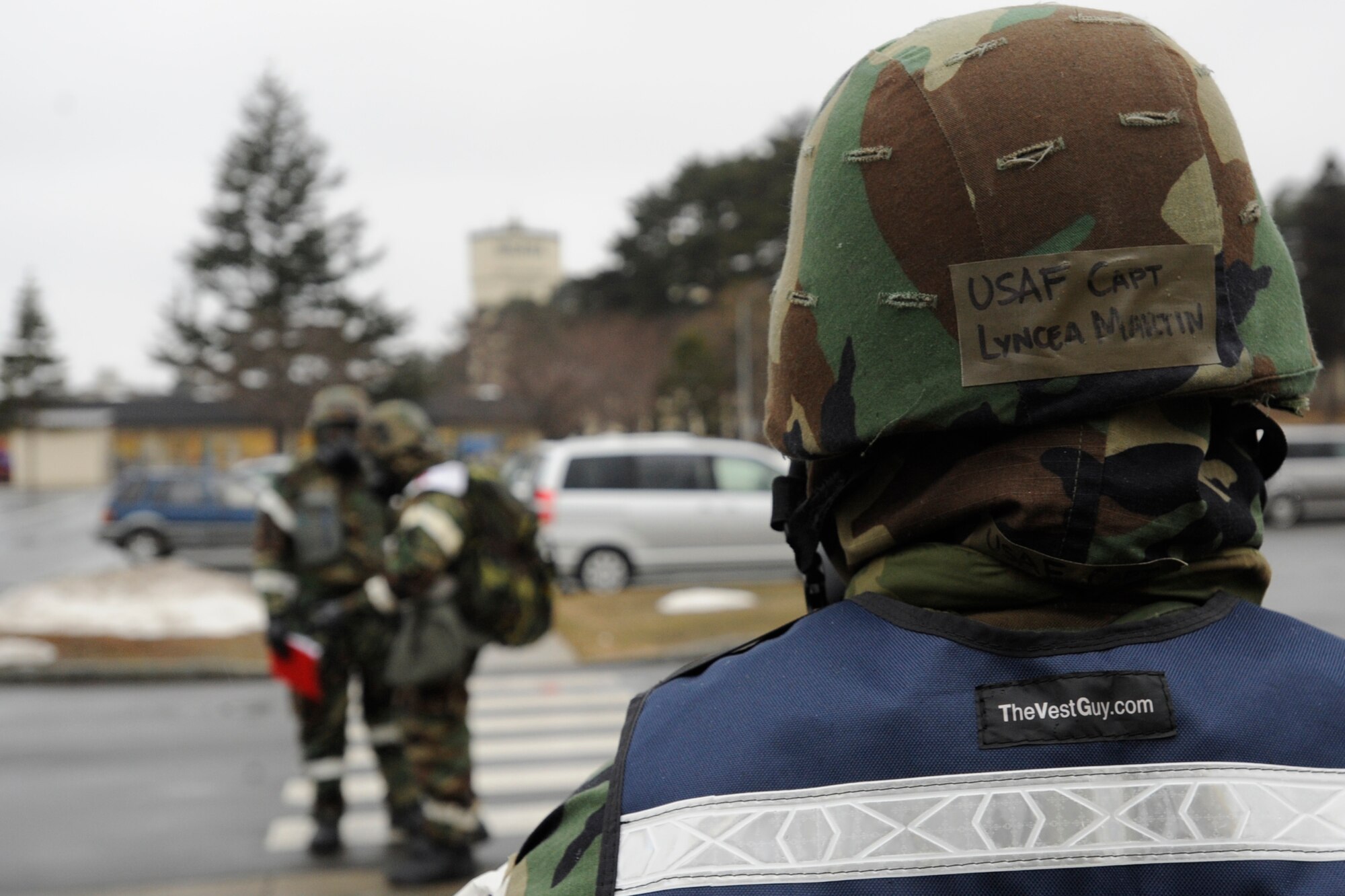 Capt. Lyncea Martin, 35th Mission Support Group, oversees Airmen as they perform a post attack reconnaissance sweep during an Operational Readiness Exercise at Misawa Air Base, Japan, March 20, 2013. This portion of the week-long exercise included multiple simulated indirect fire attacks. During the sweep, Airmen were required to identify unexploded ordnances and evaluate M-8 chemical detection paper. (U.S. Air Force photo by Airman 1st Class Kenna Jackson)