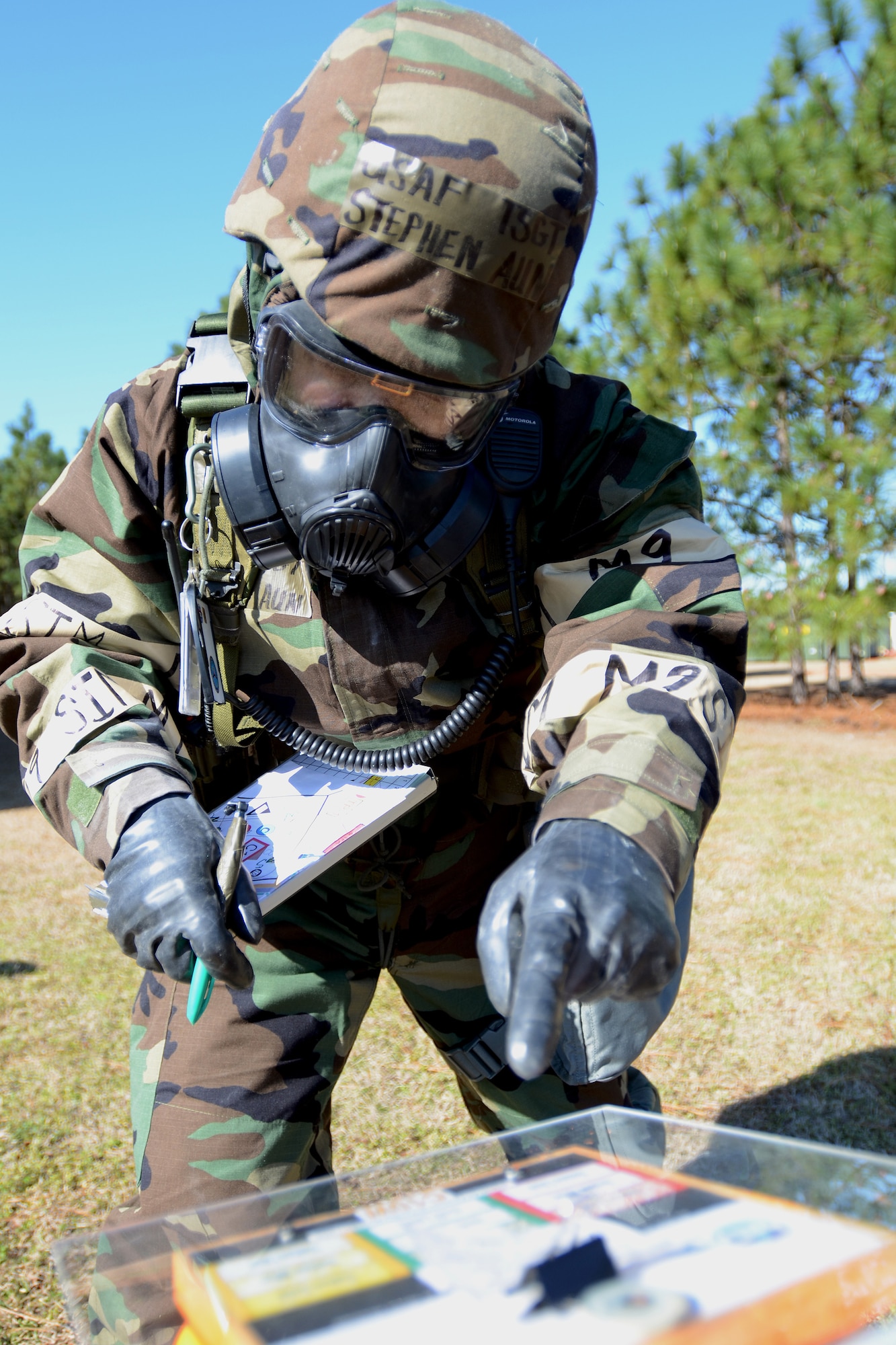 U.S. Air Force Tech. Sgt. Stephen Aun, with the 169th Communications Flight at McEntire Joint National Guard Base, S.C., inspects a chemical contamination stanchion during a post attack reconnaissance (PAR) check, March 15, 2013, after a simulated attack. PAR teams are designated for specific buildings and areas of the base to assess damage and survey the area for casualties, unexploded ordinances and chemical contamination after an attack. Personnel at McEntire are preparing for an upcoming Operational Readiness Inspection, which evaluates a unit's ability to operate and launch missions in a chemical combat environment.
(National Guard photo by Tech. Sgt. Caycee Watson/Released)
