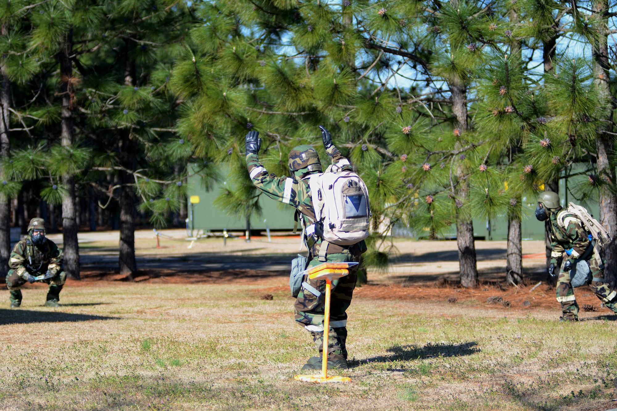 U.S. Air Force personnel with the 169th Fighter Wing at McEntire Joint National Guard Base, S.C., making up a three-person post attack reconnaissance (PAR) team, inspects the area surrounding a facility on base, March 15, 2013, after a simulated attack. A PAR team is designated for specific buildings and areas of the base to assess damage and survey the area for casualties, unexploded ordinances and chemical contamination after an attack. Personnel at McEntire are preparing for an upcoming Operational Readiness Inspection, which evaluates a unit's ability to operate and launch missions in a chemical combat environment.
(National Guard photo by Tech. Sgt. Caycee Watson/Released)
