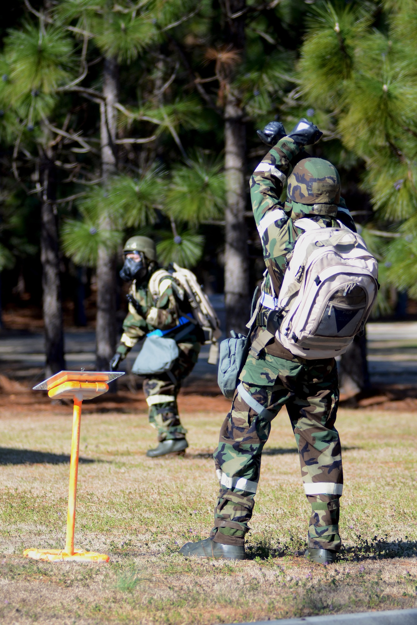 U.S. Air Force personnel with the 169th Fighter Wing at McEntire Joint National Guard Base, S.C., making up a three-person post attack reconnaissance (PAR) team, inspects the area surrounding a facility on base, March 15, 2013, after a simulated attack. A PAR team is designated for specific buildings and areas of the base to assess damage and survey the area for casualties, unexploded ordinances and chemical contamination after an attack. Personnel at McEntire are preparing for an upcoming Operational Readiness Inspection, which evaluates a unit's ability to operate and launch missions in a chemical combat environment.
(National Guard photo by Tech. Sgt. Caycee Watson/Released)