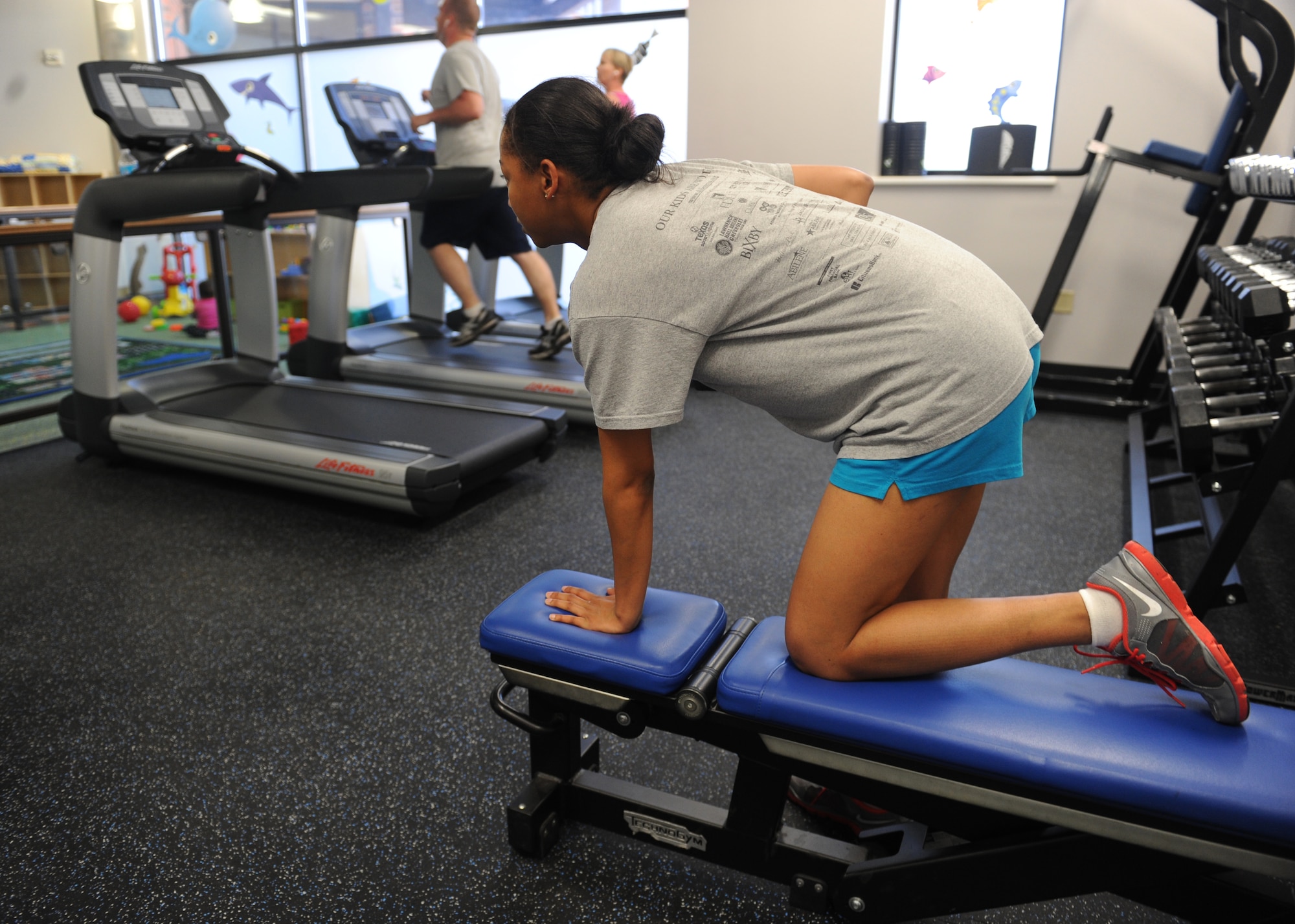 Senior Airman Zaneta Jackson, 7th Force Support Squadron, works out in the new Parent Child Activity room at the Dyess Fitness Center, March 15, 2013, at Dyess Air Force Base, Texas. The new activity room is twice the size of the old room and has a maximum capacity of eight children and eight adults. (U.S. Air Force photo by Airman 1st Class Cierra Presentado/Released)