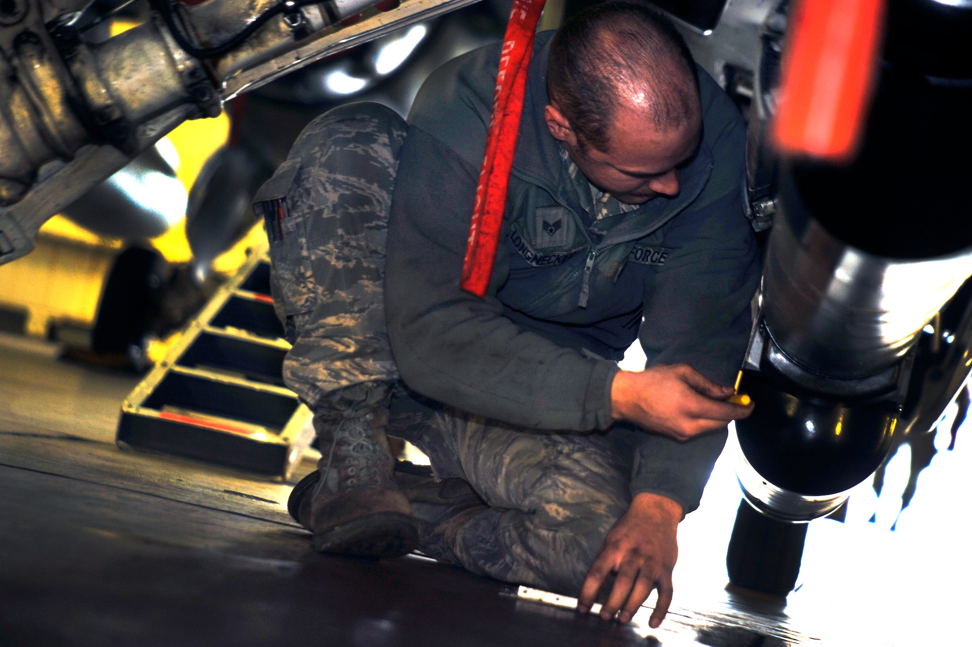 U.S. Air Force Senior Airman Teddy Longnecker, 13th Aircraft Maintenance Unit avionics technician, works on an F-16 Fighting Falcon while generating aircraft for the Operational Readiness Exercise at Misawa Air Base, Japan, March 18, 2013. During this exercise, the 13th and 14th AMUs came together to help demonstrate the wing’s overall readiness by generating safe and reliable aircraft. (U.S. Air Force photo by Airman 1st Class Zachary Kee)