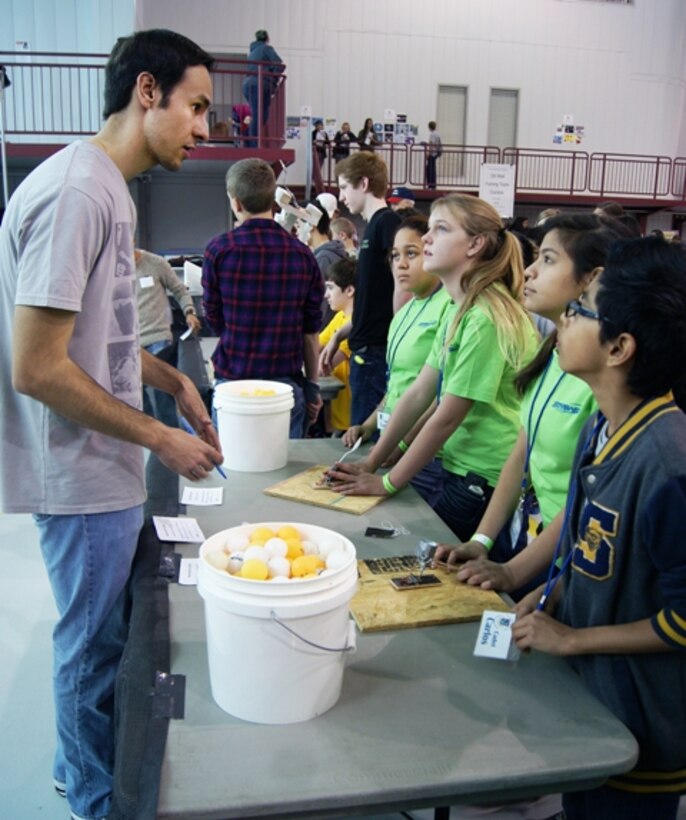 Tulsa District engineer Daniel Morales explains the competition rules to students participating in the Ping-Pong Ball Launcher event at the 25th Tulsa Engineering Challenge, March 8 at the Tulsa Technology Center in Tulsa, Okla.