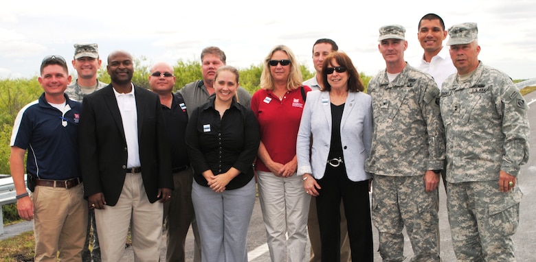 Assistant Secretary of the Army for Civil Works Jo-Ellen Darcy (fourth from right) celebrated the completion of a critical project milestone for the Tamiami Trail Modifications project alongside members of the U.S. Army Corps of Engineers team at the Tamiami Trail One-Mile Bridge Opening Ceremony March 19, 2013, in Miami, Fla. (From left: Chris Rego, South Atlantic Division Commander Col. Donald E. (Ed) Jackson, Tim Brown, Nestor Rivera, David Hobbie, Shealy Bowell, Kim Taplin, Michael Collis, Darcy, Jacksonville District Commander Col. Alan Dodd, Howie Gonzales and USACE Deputy Commanding General Maj. Gen. Todd Semonite). 