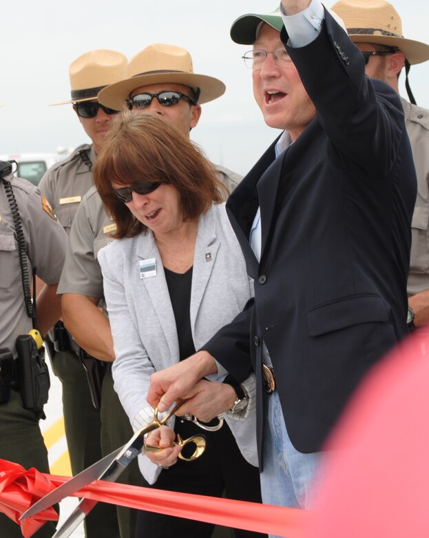 As part of the Tamiami Trail One-Mile Bridge Opening Ceremony on March 19, 2013, Assistant Secretary of the Army for Civil Works Jo-Ellen Darcy and Secretary of the Interior Ken Salazar cut a ribbon on the bridge deck prior to taking the inaugural drive across the fully-constructed bridge, which will be opened up to traffic in the upcoming weeks. 