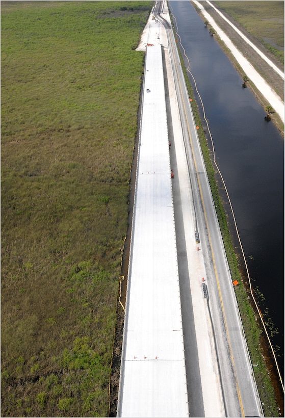 In addition to constructing the one-mile bridge, 9.7 miles of roadway will be modified to allow for increased water levels in the L-29 Canal that will flow beneath the bridge. Seventy-five percent of the roadway has been completed, and the Tamiami Trail Modifications project is scheduled to be completed by the end of the year. 