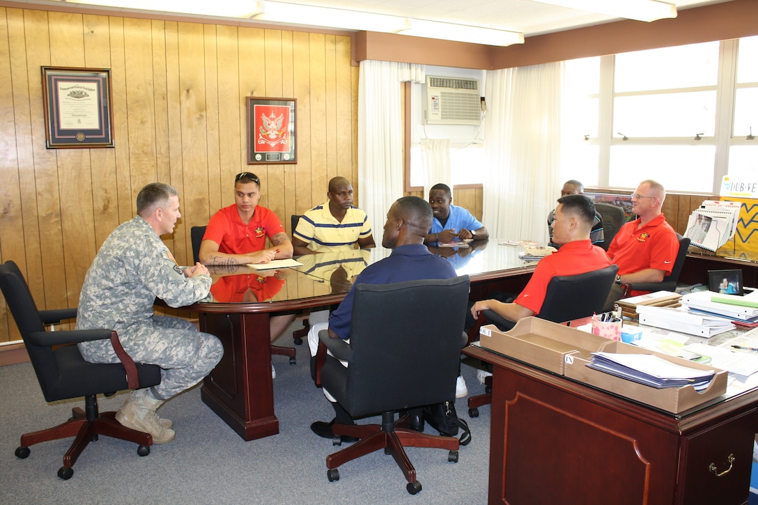 Honolulu District Commander Lt. Col. Thomas D. Asbery (left) talks to a group of U.S. Marine Corps Wounded Warriors about job opportunities with the Corps of Engineers and Honolulu District during a visit in Nov. 2012 and to help the Marines get an understanding of the District’s missions and possibly find a position working within the District. The District established an agreement with the Marine Wounded Warrior Program located at Marine Corps Base Hawaii to sponsor Marines currently placed in the program. These Marines will work in areas of their expertise or interest within the Honolulu District, allowing for continued rehabilitation and support for these well deserving warriors. The District has had an ongoing program with the Army Wounded Warrior Program out of Schofield Barracks. This partnership with the USMC is an opportunity to provide additional support.