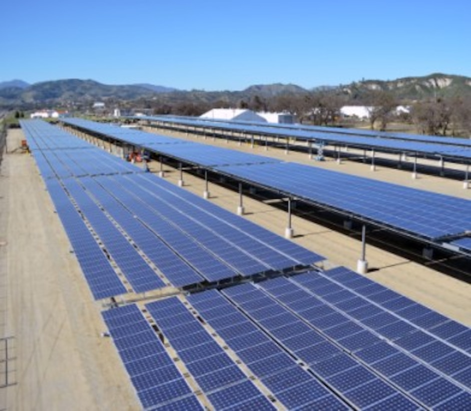 Solar panel arrays form a canopy at Fort Hunter Liggett, California. The site, photographed in March 2013, is phase one and two of an Energy Conservation Investment Program (ECIP) solar microgrid project, managed by the U.S. Army Corps of Engineers Sacramento District. A Fiscal Year 2016 ECIP project with additional rooftop solar panels, as well as a second battery energy storage system, will bring the installation to Net Zero energy once operational.