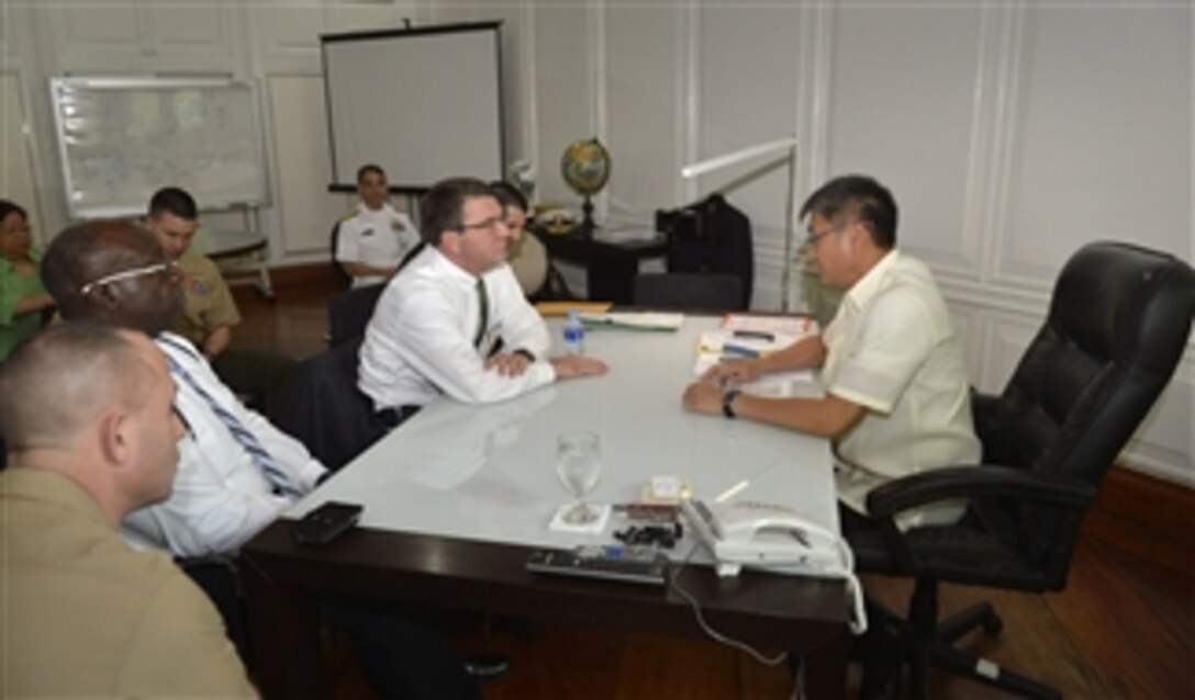 Deputy Secretary of Defense Ashton B. Carter, center, meets with Executive Secretary Paquito Ochoa Jr., right, at the Malacañang Palace in Manila, Philippines, on March 19, 2013. Carter is meeting Ochoa to discuss the continued close relationship of U.S. forces and the Philippine military as well the ongoing realignment of U.S. Forces toward the Asia-Pacific region.  Ochoa is the chief of staff to President Benigno Aquino III.   