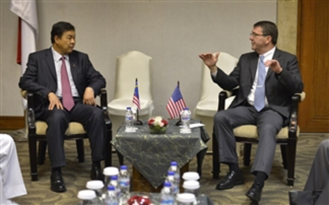 Deputy Secretary of Defense Ashton B. Carter, right, and Malaysian Minister of Defense Ahmad Zahid Hamidi conduct a bi-lateral meeting in Jakarta, Indonesia, on March 20, 2013.  Both Carter and Zahid are attending the Jakarta International Defense Dialogue.  