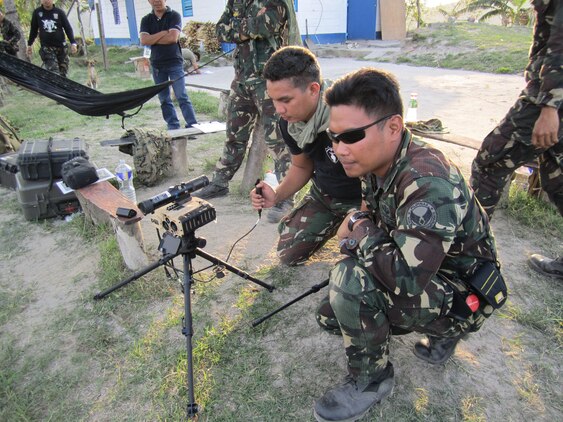 Airmen with the Philippine Air Force use a joint terminal attack controller laser target designator during mutual-defense board security engagement board events in the Philippines March 7, 2013. Exercise Haribon Tempest, the unofficial nickname MAG-12 gave for last month’s MDB/SDB event took place March 6-9, 2013. The name originates from the Haribon, which is a Philippine Eagle that preys on monkeys.                  