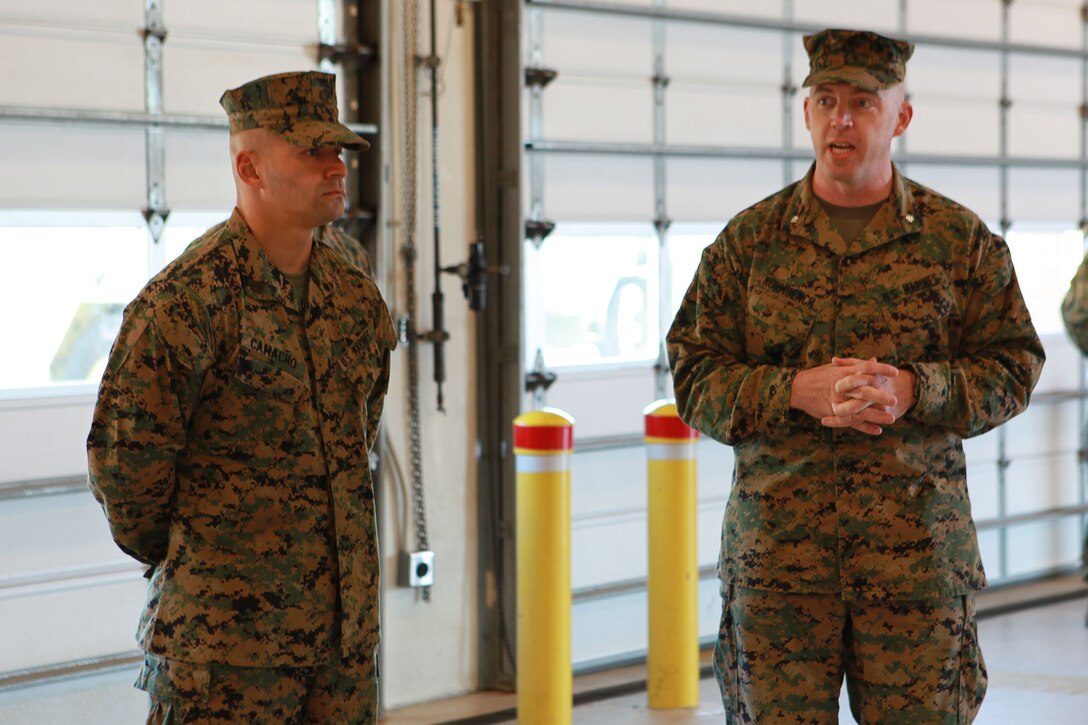 Lt. Col. William Kohmuench, Marine Wing Support Squadron 273 commanding officer, talks about the heroic actions of Sgt. Fernando Camacho during their deployment in Afghanistan, March 4. Camacho was awarded a Navy and Marine Corps Achievement Medal with combat distinguishing device for his actions during an assault on Camp Bastion, Afghanistan. 