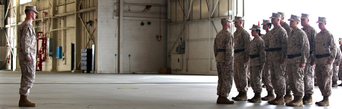 Lt. Col. Kevin T. O'Rourke, the commanding officer of VMFA(AW)-533 takes charge of the squadron, known as the Hawks, during a change of command ceremony, March 11. 
