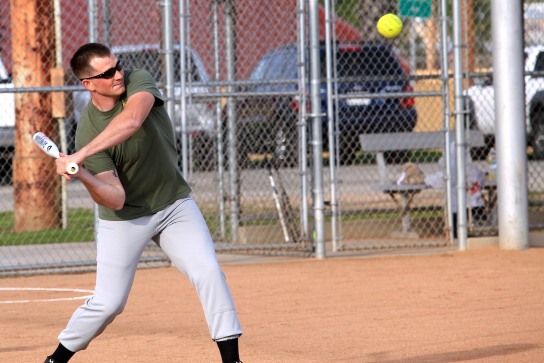 Lance Cpl. Mathew Whaley, a training noncommissioned officer with 1st Intelligence Battalion, from Dandridge, Tenn., prepares to hit a pitch in an effort to help his team win their first regular season softball game at Camp Pendleton, Calif., March 19. The softball games are part of a competition known as the Commanding General's Cup. The cup has 23 events and provides Marines an opportunity to develop unit cohesion through competition outside of the work area.