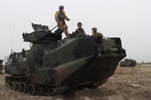 Marines serving with 3rd Assault Amphibian Battalion explain the capabilities of assault amphibious vehicles to Capt. Bernard Tay, a company commander serving with 3rd Battalion Singapore Guards, before conducting amphibious assault training during Exercise Valiant Mark. Aging weapons systems such as the AAV are more likely to incur supplier items or raw material shortages that the proactive Diminishing Manufacturing Sources and Material Shortages program is designed to address. 
