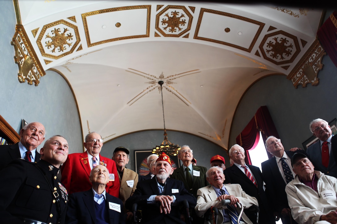(second from left) Col. Christopher C. Starling, commanding officer of the 23rd Marine Regiment, gathers with World War II Iwo Jima veterans at the Marine Memorial Hotel library in San Francisco March 13, 2013. He was the guest speaker to commemorate the 68th Anniversary of the Battle of Iwo Jima with a luncheon ceremony. The event was also an opportunity to accentuate the connection between the WWII-era 4th Marine Division with today's 4th Marine Division and Marine Forces Reserve. More than 100 veterans, modern Marines and guests were in attendance. 