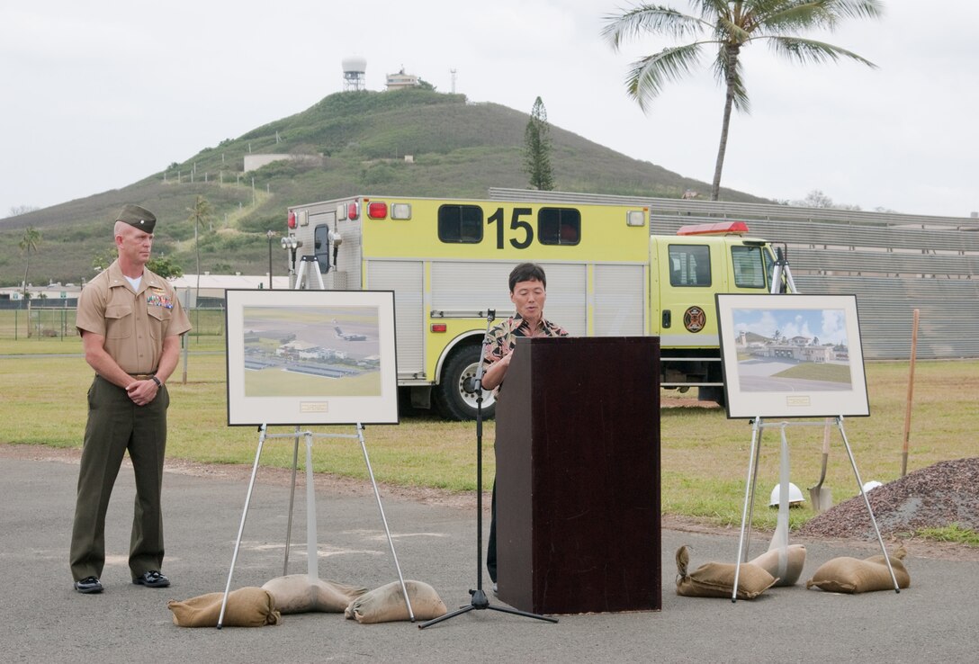 MARINE CORPS BASE HAWAII – Duane Hamada, a principal with Design Partners Inc., addresses the crowd during the Marine Corps Air Station Operations Complex groundbreaking, March 15, 2013. DCK Pacific Construction, LLC was awarded the contract to design and, among other contractors, construct the two new buildings aboard the base. The ceremony was held near the Aircraft Rescue and Firefighting building. The $46.6 million project includes a new terminal operations building, an ARFF building with individual dormitories for ARFF Marines, bays for fire trucks and office spaces. The complex is scheduled for completion in September 2014. (U.S. Marine Corps photo by Kristen Wong)