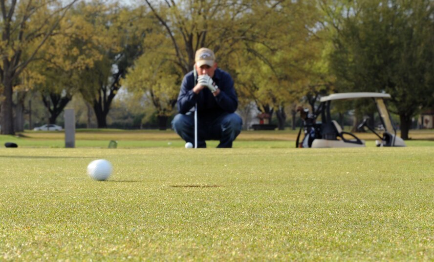 Master Sgt. Don Dixon, 2nd Munitions Squadron, watches a golf ball at the Fox Run Golf Course on Barksdale Air Force Base, La., March 21. The golf course, a U.S. Golf Association regulated 18-hole course, is open daily from 7 a.m. until dusk. (U.S. Air Force photo/Airman 1st Class Benjamin Gonsier)