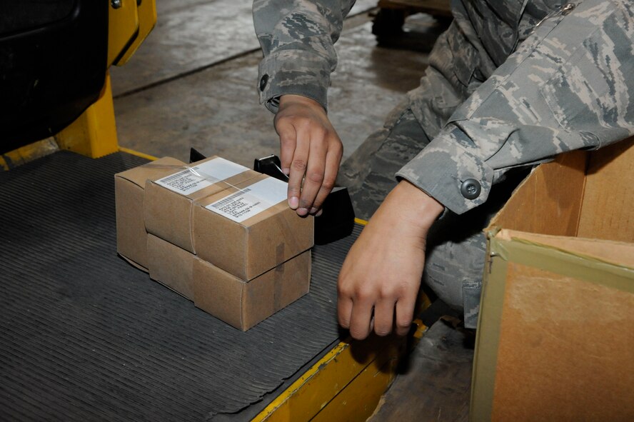 Airman 1st Class Jazmin Rodriguez, 2nd Logistics Readiness Squadron Aircraft Parts Store, tapes boxes together on Barksdale Air Force Base, La., March 21. The 2 LRS has begun consolidating parts to the flightline called the Building Consolidation Project in order to free up space at the 2 LRS Material Management flight, and make it easier for maintainers to receive parts. (U.S. Air Force photo/Airman 1st Class Andrew Moua)