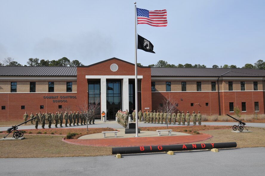A short ceremony was held at the Combat Control School wrapping up the 6 mile journey around the Pope Field, N.C. flightline while carrying a 1,250lbs log dedicated to Staff Sgt. Andrew Harvell who was killed while serving in Afghanistan Sept. 9, 2011. Instructors and student of the school, as well as current special tactics operators recognized those that have made the ultimate sacrifice. (U.S. Air Force photo/Adam Luther) 

