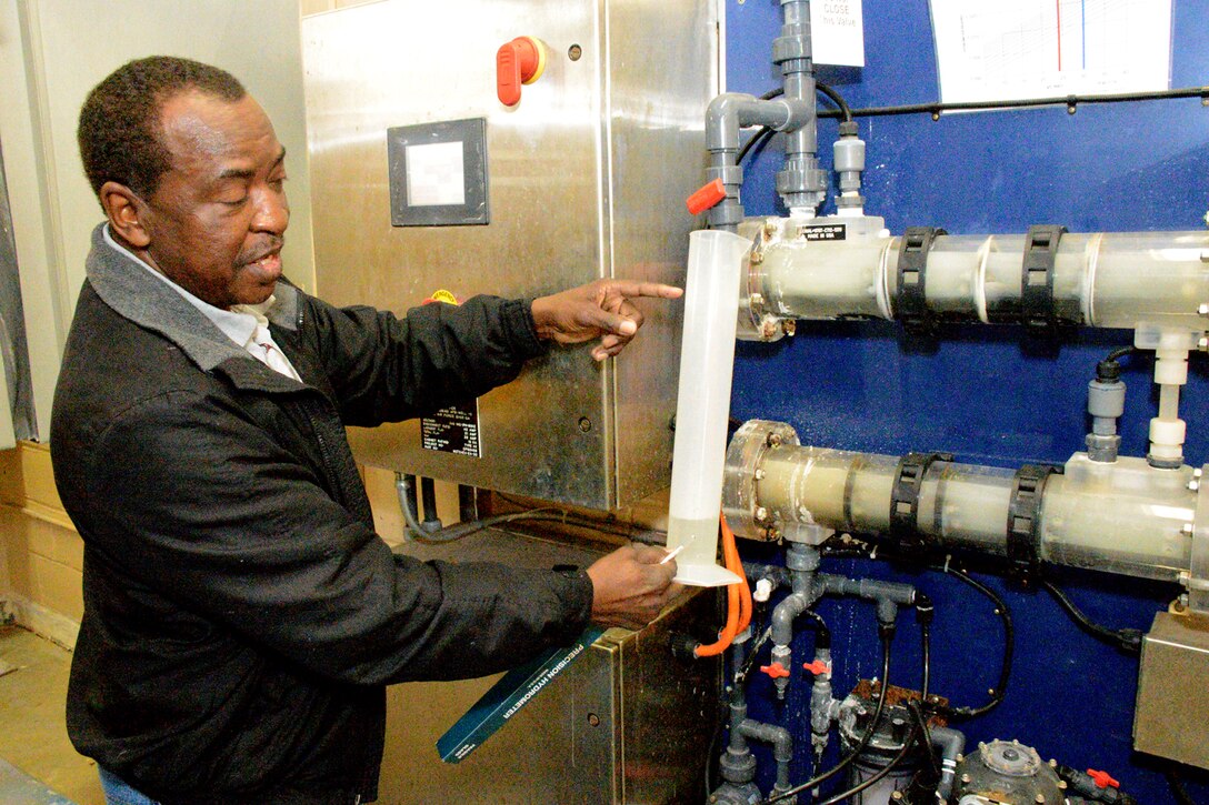 Tallie Daniel, Water Treatment Plant operator, explains the Chlortec onsite chlorine generation system. At Robins, the base water plant employees operate the public water treatment system, providing water for irrigation, industrial purposes and drinking to a workforce of more than 20,000 people. (U.S. Air Force photo by Ed Aspera)