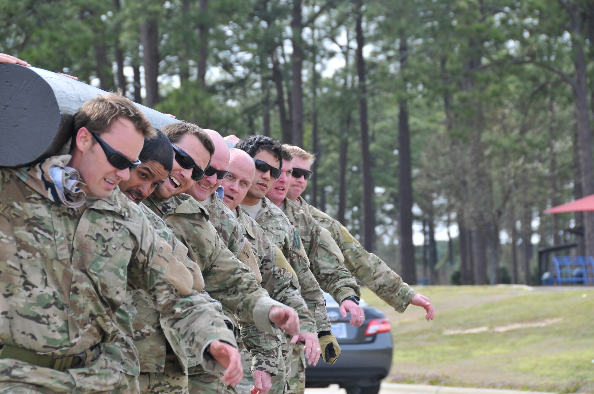 Instructors from the Combat Control School at Pope Field, N.C. participated in carrying a log dedicated to fallen comrade Staff Sgt. Andrew Harvell around the flightline, Mar. 15, 2013.  The log, estimated to weigh 1,250lbs, is carved with the words “Big Andy” on one side and “Victory or Valhalla” on the other.  The 6 mile journey started and ended at the Combat Control School but was shared by members of the 21st Special Tactics Squadron and the 24th Special Tactics Squadron.  (U.S. Air Force photo by Adam Luther, 440 AW/PA)