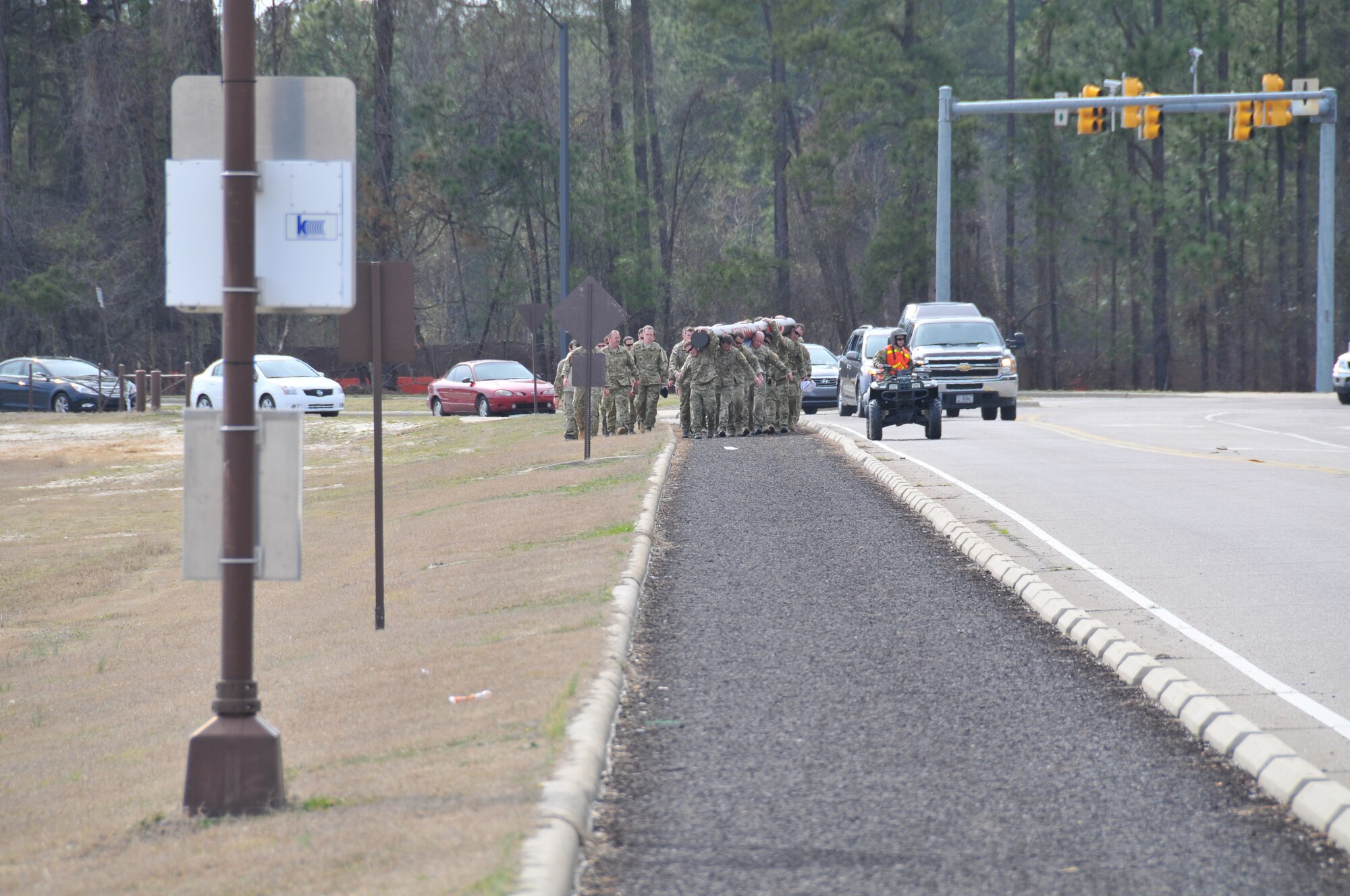Instructors from the Combat Control School at Pope Field, N.C. participated in carrying a log dedicated to fallen comrade Staff Sgt. Andrew Harvell around the flightline, Mar. 15, 2013.  The log, estimated to weigh 1,250lbs, is carved with the words “Big Andy” on one side and “Victory or Valhalla” on the other.  The 6 mile journey started and ended at the Combat Control School but was shared by members of the 21st Special Tactics Squadron and the 24th Special Tactics Squadron.  (U.S. Air Force photo by Adam Luther, 440 AW/PA)