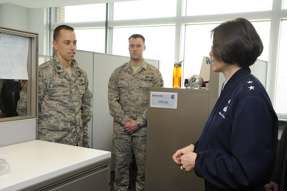 Air Force District of Washington Commander Maj. Gen. Sharon K.G. Dunbar congratulates Capt. Chase Eiserman, AFDW Contracting Officer, for earning the Outstanding Contracting Officer Award in the Company Grade Officer category March 11, 2013 on Joint Base Andrews, Md. “I have never been more proud of my organization,” Eiserman said. “It’s great to know the Air Force has recognized the incredible talent and professionalism this group of Airmen embodies.”  (U.S. Air Force photo by Staff Sgt. Christopher Ruano)