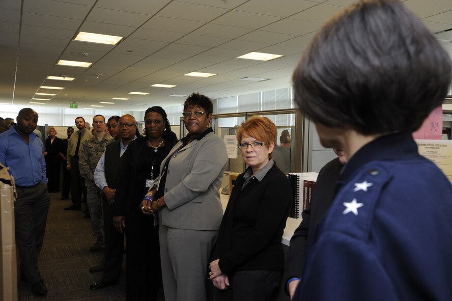 Air Force District of Washington Commander Maj. Gen. Sharon K.G. Dunbar congratulates the Headquarters AFDW Contracting office for winning Air Force-level awards March 11, 2013 on Joint Base Andrews, Md. “I spent 13 years in contracting so I know how hard it is,” Dunbar said to the HQ AFDW contracting civilian and military Airmen. “I know what it takes to get that level of recognition.” (U.S. Air Force photo by Staff Sgt. Christopher Ruano)