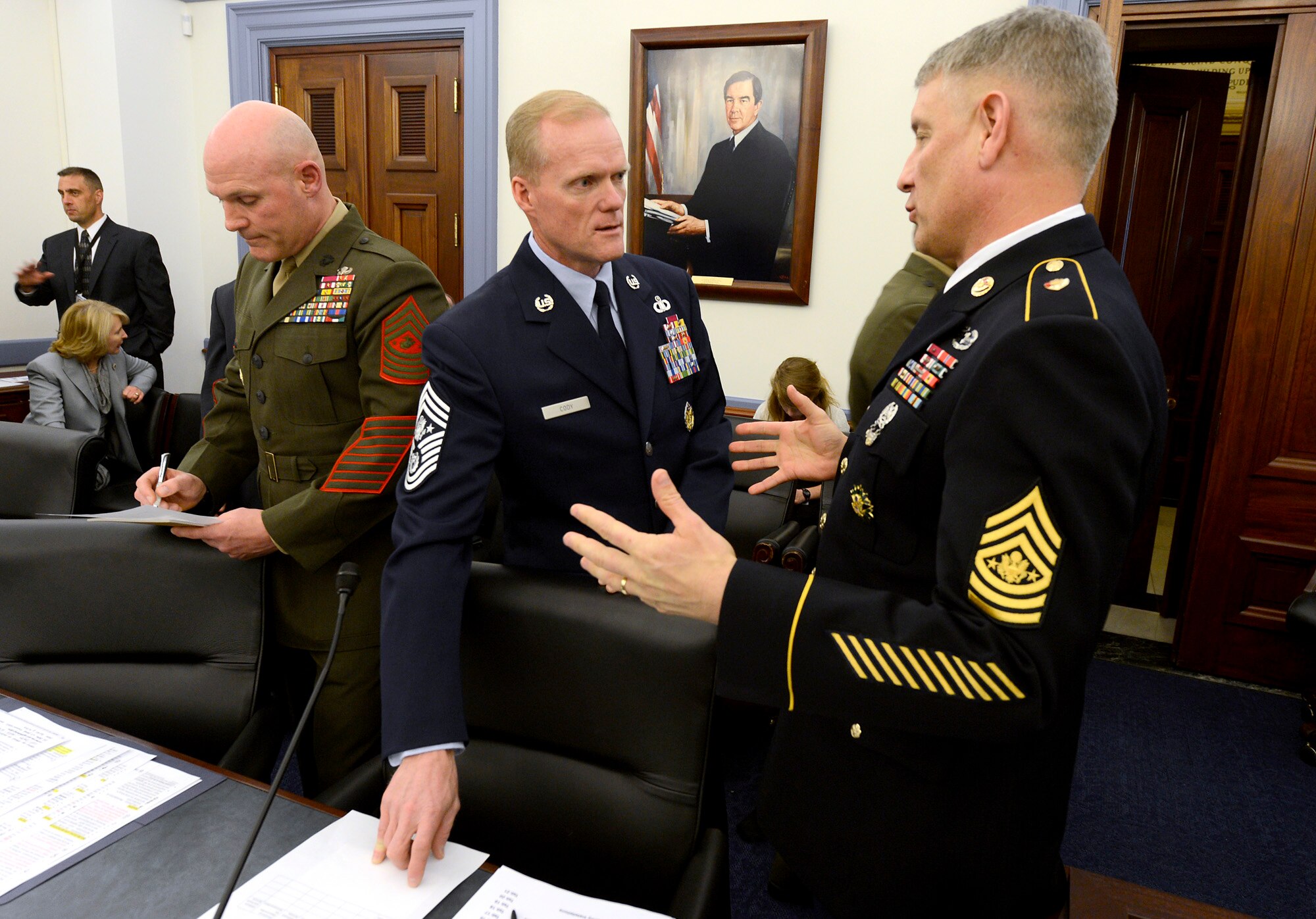 Chief Master Sgt. of the Air Force James Cody talks with Sergeant Major of the Army Raymond Chandler as they prepare to testify before members of the House Appropriations Committee on Capitol Hill March 19, 2013.  The two senior enlisted leaders, along with Sergeant Major of the Marine Corps Micheal Barrett, testified on the quality of life in the military.  (U.S. Air Force photo/Scott M. Ash)