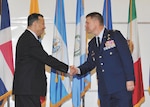 IAAFA Commandant, U.S. Air Force Col. Marc Stratton, right, thanks former IAAFA commandant, retired U.S. Air Force Col. Jaime Vazquez, after Vazquez addressed the crowd during the Academy's 70th anniversary celebration at the IAAFA Airfield Training Complex, Joint Base San Antonio-Lackland. (U.S. Air Force photo by Alan Boedeker/Released)