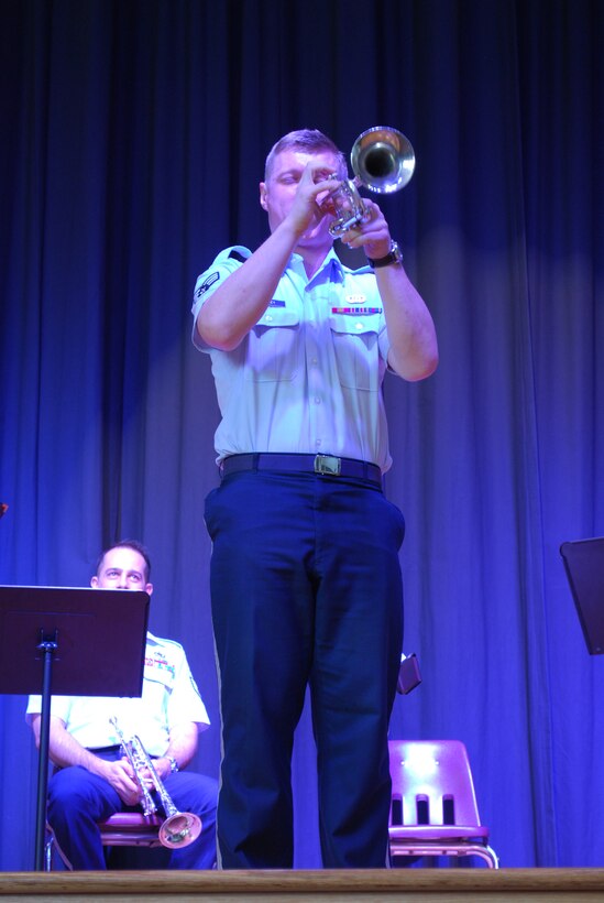 SrA Stanley discusses the trumpet and demonstates it's military heritage with a bugle call.