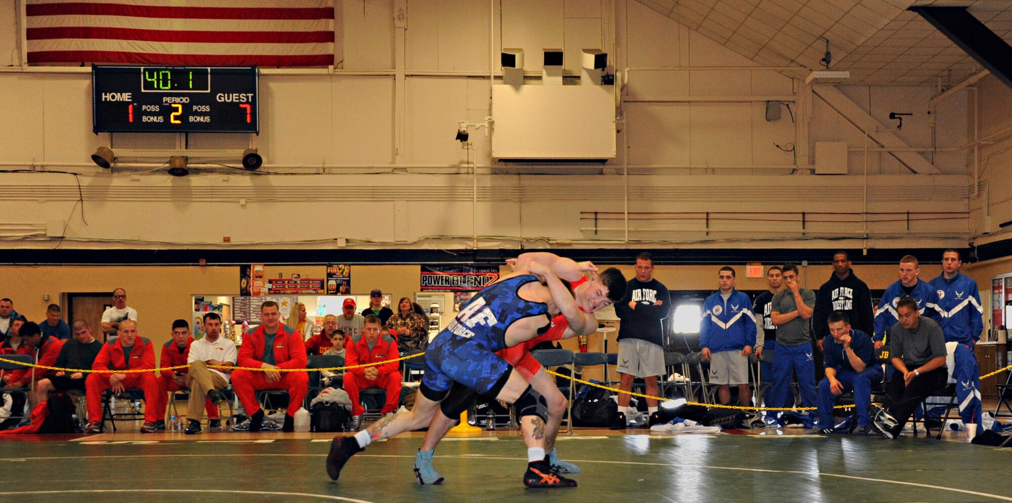 Marine Alexander Holloway attempts an overhook throw on Air Force Nathan Higgins. The two competed in the 66 kg. weight class March 17 at the Griffith Field House here. Holloway, a Marietta, Ga., native, is assigned to Headquarters Support Battalion at Camp Lejeune, N.C. Higgins is stationed at Royal Air Force Lakenheath, United Kingdom. He calls Fairbanks, Alaska, home. (U.S. Air Force photo by Senior Master Sgt. Denise Johnson/Released)