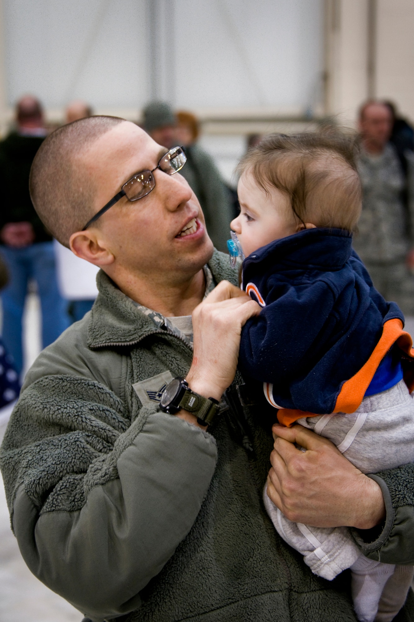 GRISSOM AIR RESERVE BASE, Ind. -- Staff Sgt. Michael McClintock, 434th Security Forces Squadron fire team member, gets a good look at his son Jack, who was born while he was deployed to the Transit Center at Manas, Kyrgyzstan, March 6. Jack was born in October while his father and 20 other security forces Airmen provided security for the base. (U.S. Air Force photo/Senior Master Sgt. Scott Fleek)
