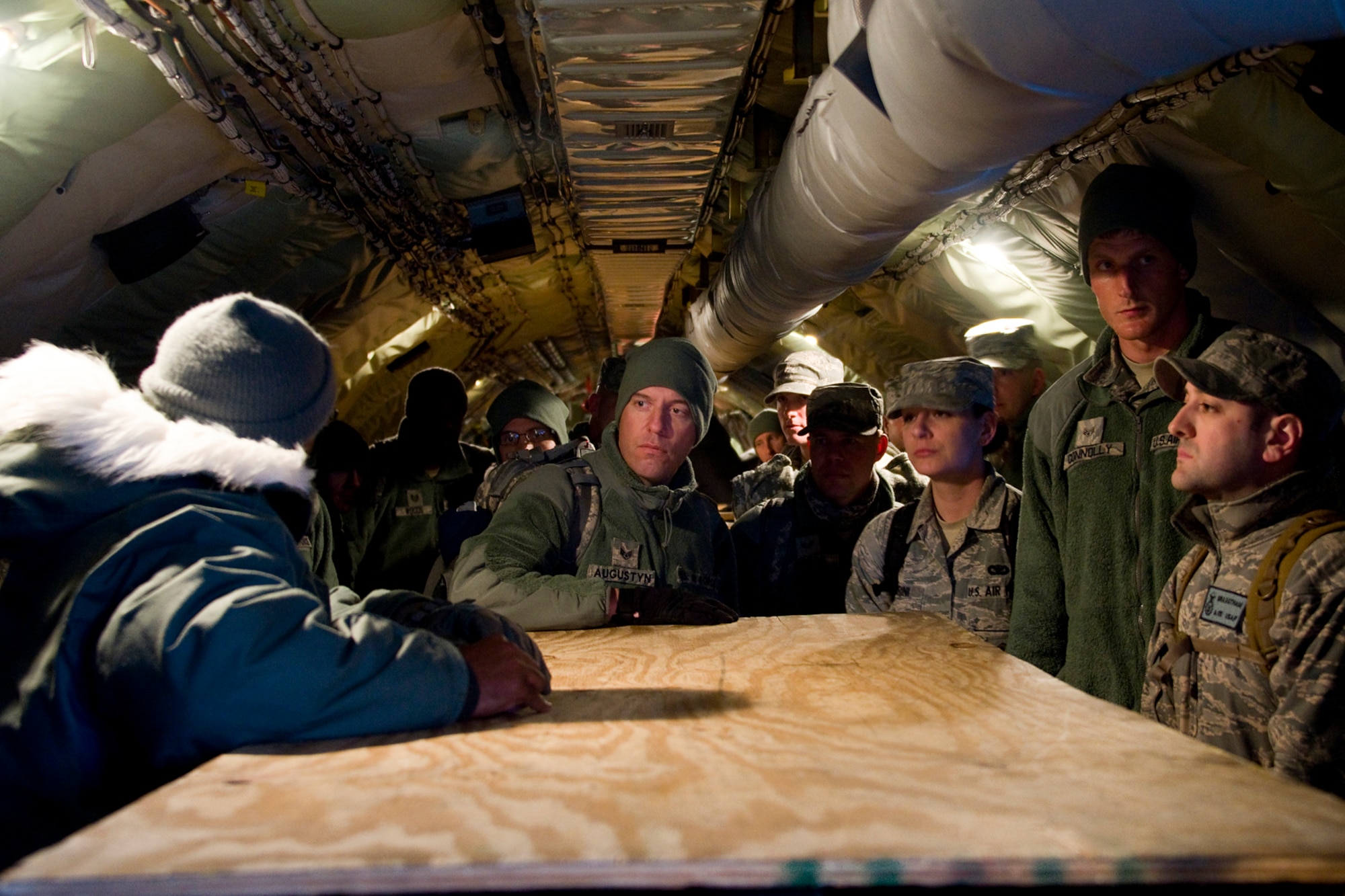 GRISSOM AIR RESERVE BASE, Ind. -- Staff Sgt. Timothy Augustyn, 434th Security Forces Squadron security response team leader, and other 434th SFS Airmen wait to deplane a KC-135R Stratotanker here at Grissom after returning from a six-month deployment to the Transit Center at Manas, Kyrgyzstan, March 6. Augustyn and 20 other security forces Airmen deployed for six months to provide security for the base. (U.S. Air Force photo/Senior Master Sgt. Scott Fleek)
