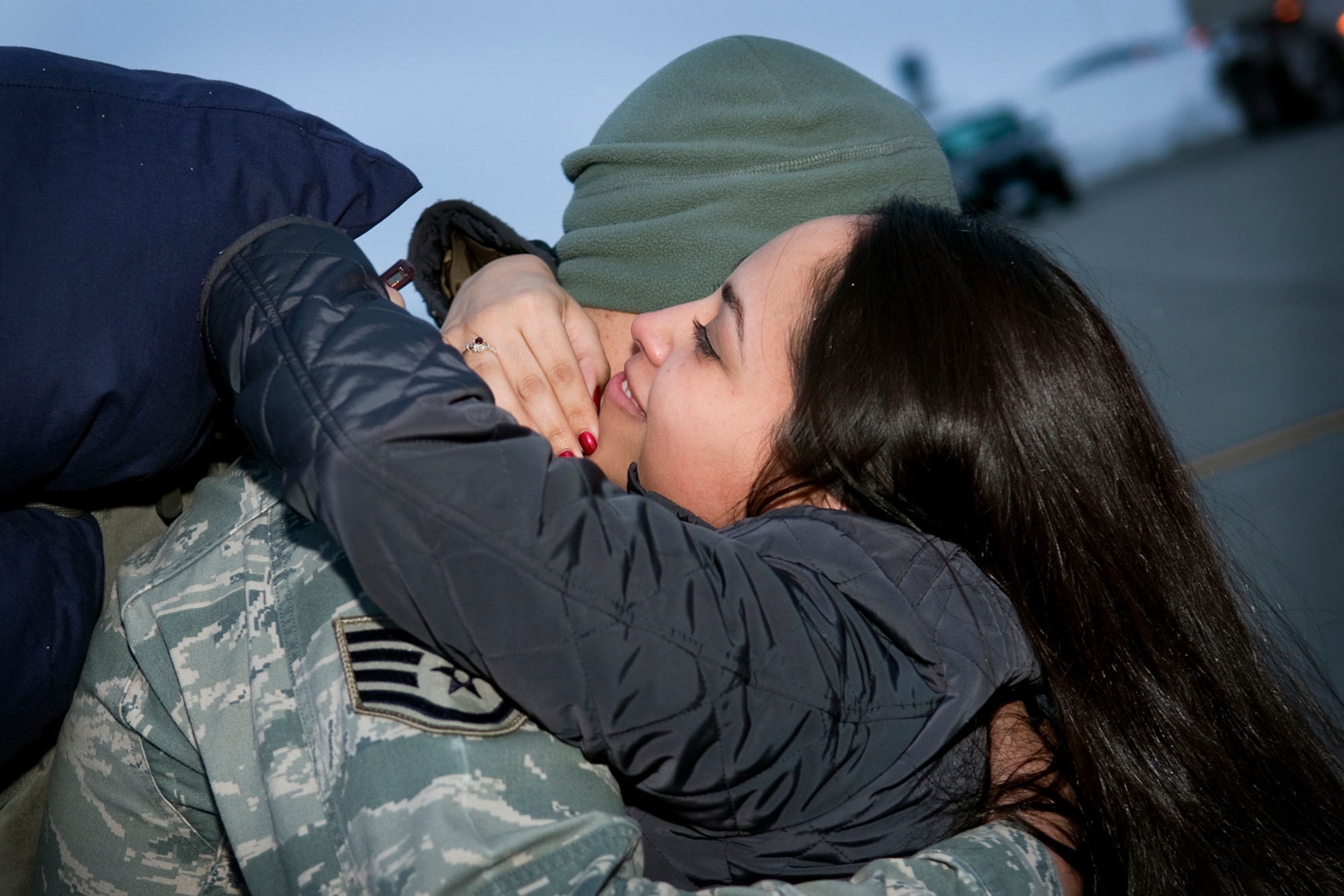GRISSOM AIR RESERVE BASE, Ind. -- Melissa Martinez hugs her husband, Staff Sgt. James Craig III as he and 20 other 434th Security Forces Squadron Airmen returned home from a six-month deployment to the Transit Center at Manas, Kyrgyzstan, March. 6. Craig is a fire team leader who helped provide security for the base. (U.S. Air Force photo/Tech. Sgt. Mark R. W. Orders-Woempner)
